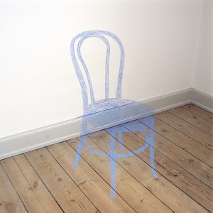 The shade of a chair painted onto wall, panel and floor