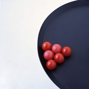 Two plastic balls and four tomatoes 