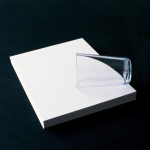 Glass on a pile of paper